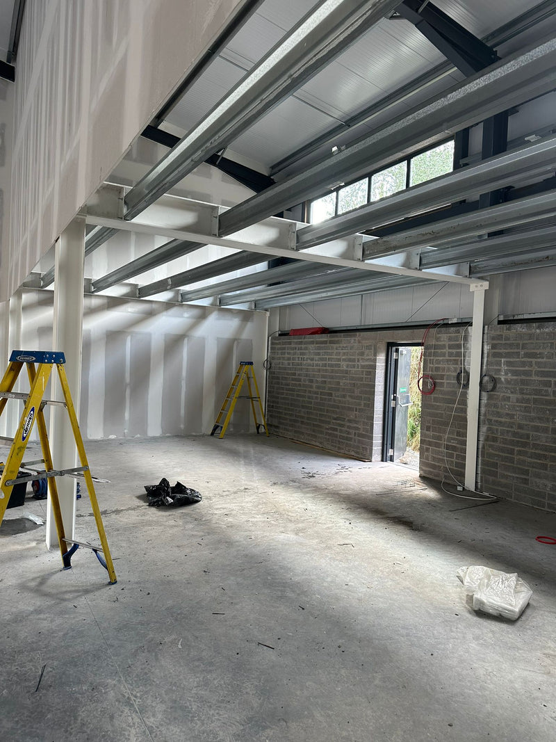 Underconstruction building with metal beams and concrete floor